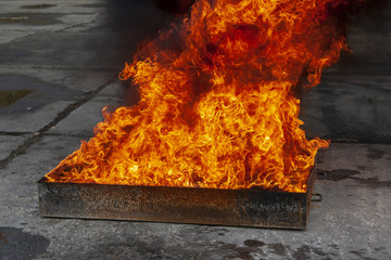 Flame in an iron box with water.