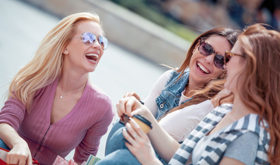 Beautiful girls with shopping bags in the city