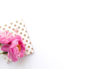 Styled flatlay - pink peonies, gold notebook, with white space / background