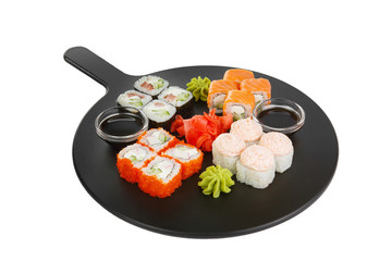 A set of sushi, rolls, uramaki, hosomaki, california, philadelphia, lava sauce, tobiko caviar, raw seafood, soy sauce, marinated ginger and wasabi, white isolated background Side view For the menu