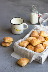 Freshly baked cottage cheese and sugar cookies (triangles, angles) in a white box. Crow's feet. Easter recipe.