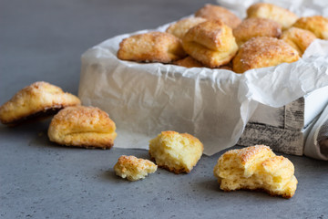 Freshly baked cottage cheese and sugar cookies (triangles, angles) in a white box. Crow's feet. Easter recipe.