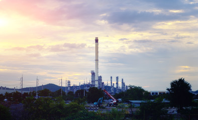 Fototapeta premium Industrial of chemical or petrochemical on sunset background.
