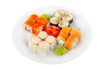 Set of sushi, rolls, uramaki, hosomaki, california, philadelphia, lava sauce, tobiko caviar, raw seafood, marinated ginger and wasabi, food on plate, white isolated background Side view For the menu