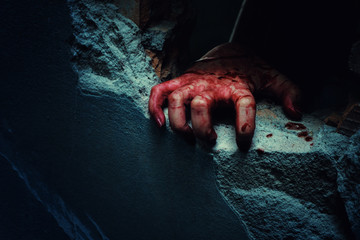 Horror Scene with bloody hand of evil is coming from a dark hole. - obrazy, fototapety, plakaty