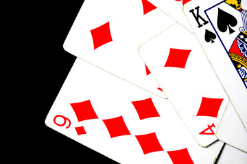 Playing cards on a dark background close up