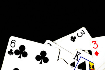 Playing cards on a dark background close up