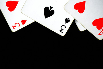 Playing cards on a dark background close up