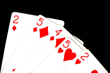 Playing cards on a dark background close up