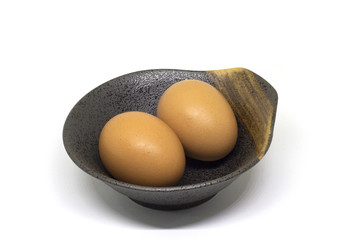 Brown Egg in the Cup on White Background with copy space