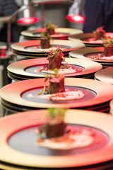 A chef prepares a fried beef gourmet dinner.