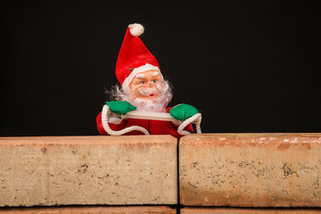 Santa trying to climb the wall