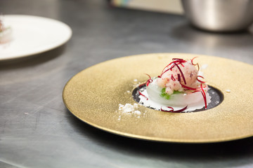 An ice cream sorbet desert prepared by a gourmet chef