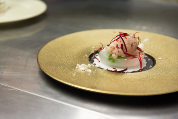 An ice cream sorbet desert prepared by a gourmet chef