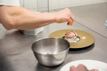 An ice cream sorbet desert prepared by a gourmet chef