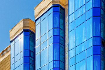 The blue background with the top part of the office building