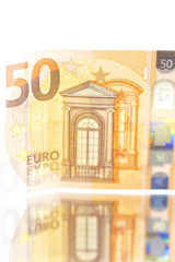 blurred euro money background and mirror