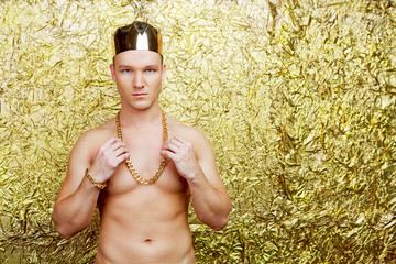  dancer wearing costume with a golden crown