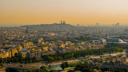 Fototapeta na wymiar Beautiful view of the hill of Montmartre, the Sacré Coeur Basilica, the Central areas of Paris with the Eiffel tower in the morning colors