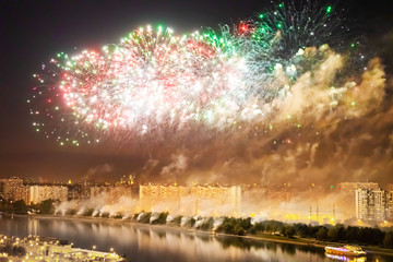 abstract background, fireworks over the night city by the river.