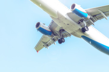 plane lands, landing gear, turbines, against the sky, close-up