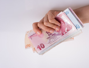 Hand holding Turksh Lira banknotes  in hand