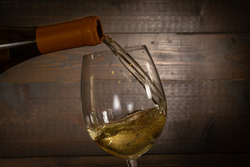 White Wine Pouring in Glass