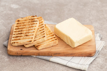Toast and butter for breakfast. Horizontal view view