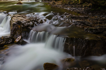 The waterfall on the long exposure in the Carpathian Mountain