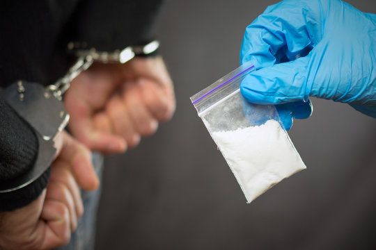 Police Detention Drug Courier.  A Police Officer Finds Drugs During The Search Of Drug Dealers