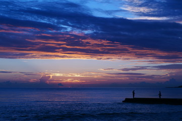 sunset and fisherman
