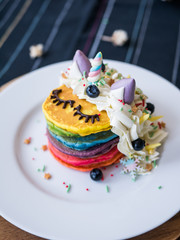 Obraz na płótnie Canvas Fresh baked cute unicorn Rainbow Pancake with. kids meal.