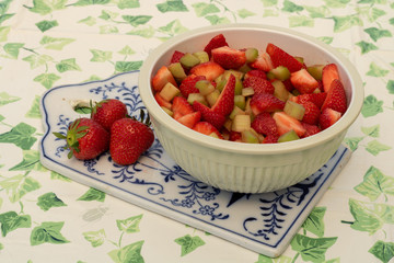 Strawberries and rhubarb pieces in a beautiful bowl