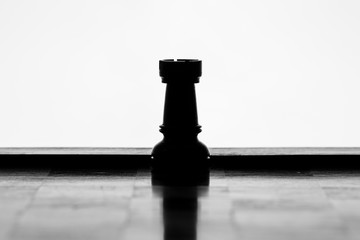 Rook chess piece silhouette on a white background