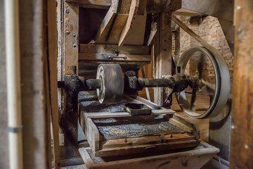Old machinery of abandoned mill factory from the inside. Dobele, Latvia.