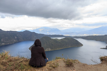 View on a tourist at vulcano lake cuicocha close to otavalo, ecuador