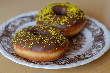 Fresh baked donuts served on a plate 