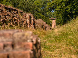Watchtower and medieval city wall surrounding the town of Ferrara, Italy