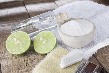 baking soda and lemon on wooden table