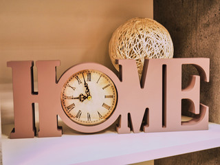 Home decoration of letters Home, Clock and a bowl of wicker from a vine. Beautiful writing home with clock instead of letters o, Home Holidays decoration