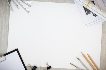 Architectural plans, pencil and ruler on the table. Place for your text