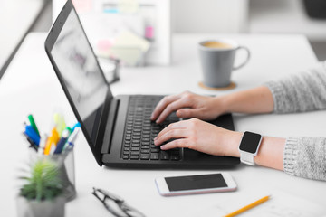 app design, technology and business concept - web designer or developer with smart watch working on user interface and drawing sketches at office