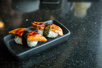 Fresh salmon slice and japanese on dish by lettuce and radish. Clean and fresh food for healthy concept.