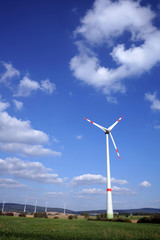 Wind turbine with energy park as background in Lower Saxony, Germany