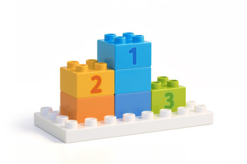 Left side view of winners pedestal built from colorful blocks.