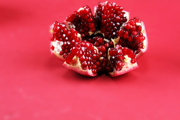 Ripe Pomegranates. sliced pomegranate on a table.