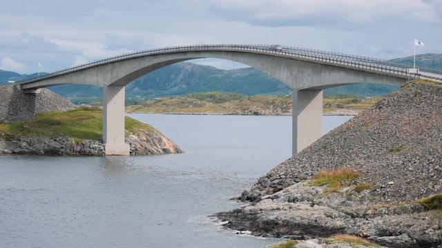 Cars crossing freeway bridge over a fjord in Norway. 4k, high resolution