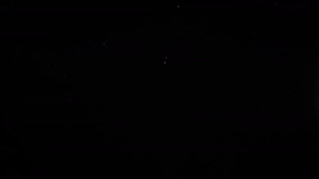 Authentic organic dust particles on black background moving dynamic in black room. Glittering sparkling particles in the air. effect overlay channel for dramatic scenes