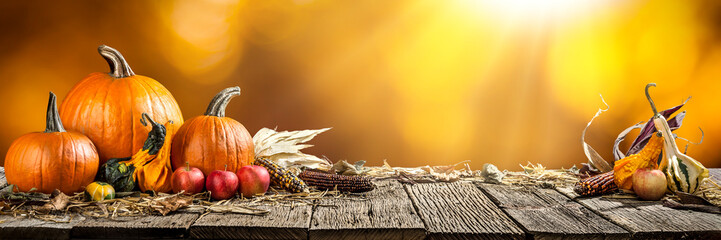 Thanksgiving With Pumpkins Corncob And Apples On Wooden Table