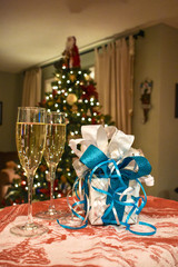 Celebrating holiday evenings together with champagne and gifts